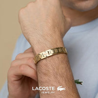 Lacoste bracelet with toggle clasp, METROPOLE collection. Decorated with a petit piqué pattern - Available for him and her. 